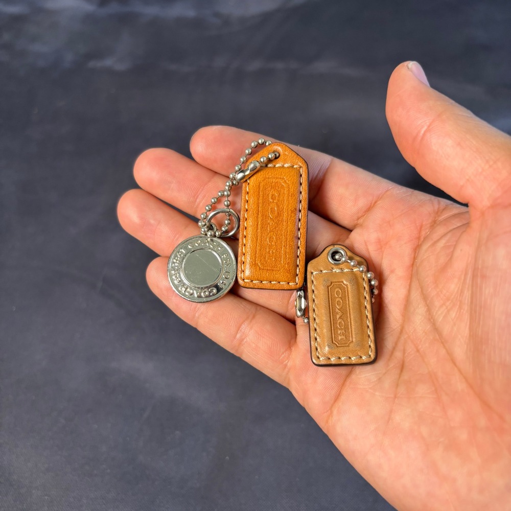 Coach Vintage Leather Hangtag and Silver Tone Medallion Charm Bundle 3pc Tan